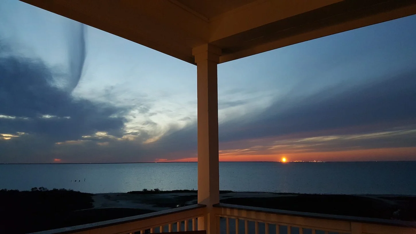 Sun setting over the bay from a Galveston vacation home