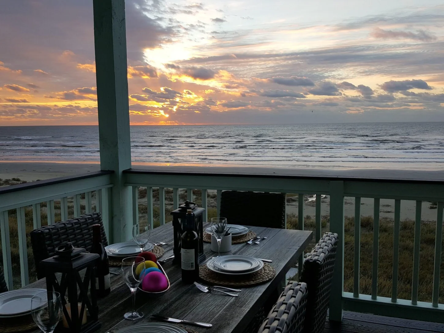 Early morning sky and Gulf water seen from a beachfront deck