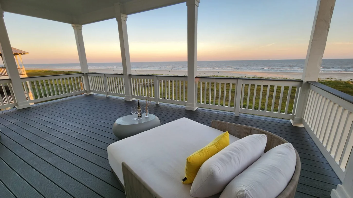 Cushioned lounge seats on the deck overlooking the Gulf at The ONE